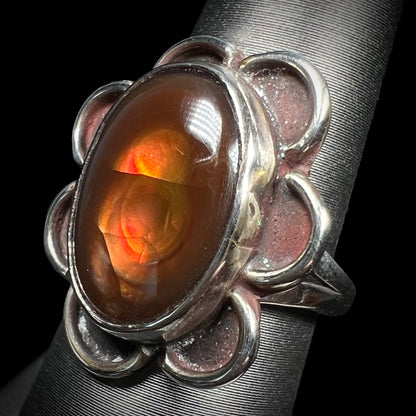 Southwest blossom-style fire agate ring shown at a slight side angle.