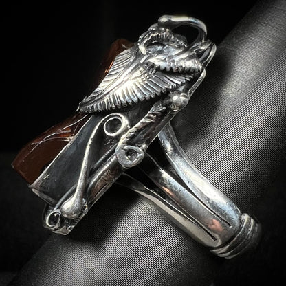 Side view of a men's silver, Southwest-style fire agate ring.