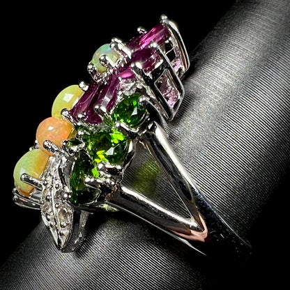 Side view of a multi-gemstone ring, showing the sterling silver split shank.