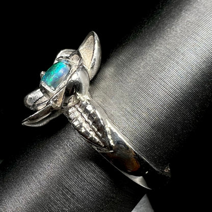 Side view of sterling silver lotus flower design ring set with solid Australian black opal