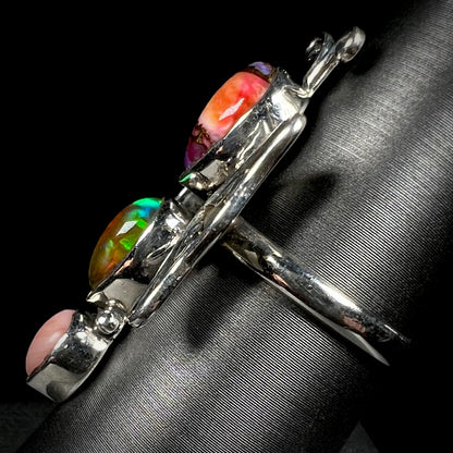Side view of a sterling silver butterfly ring shown from the side view.