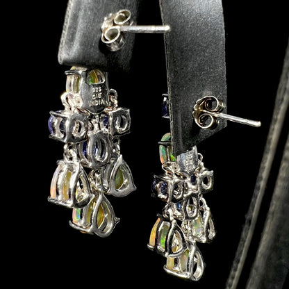 Back of a pair of sterling silver Ethiopian opal and tanzanite chandelier earrings.