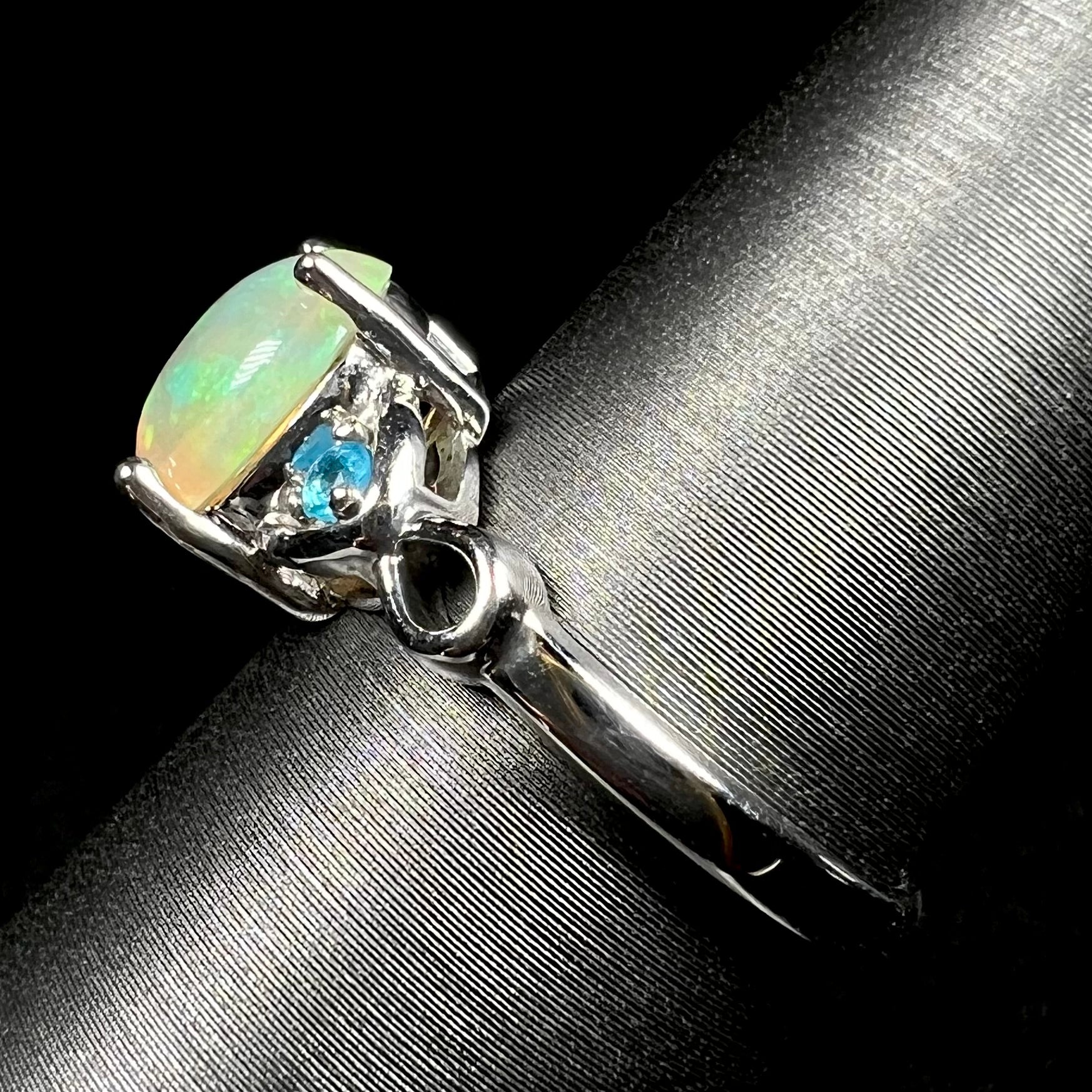 Side view of sterling silver Ethiopian opal ring on ring display
