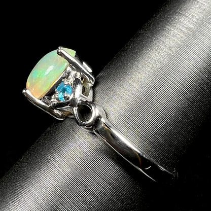Side view of sterling silver Ethiopian opal ring on ring display