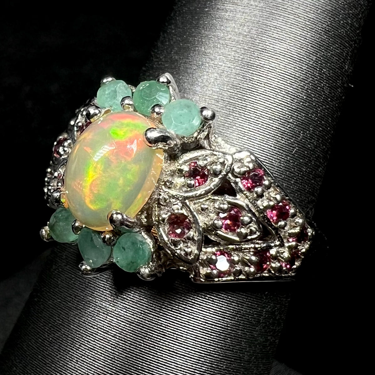 Sterling silver Ethiopian opal and rhodolite garnet-accented ring with green beryl embellishments on ring display