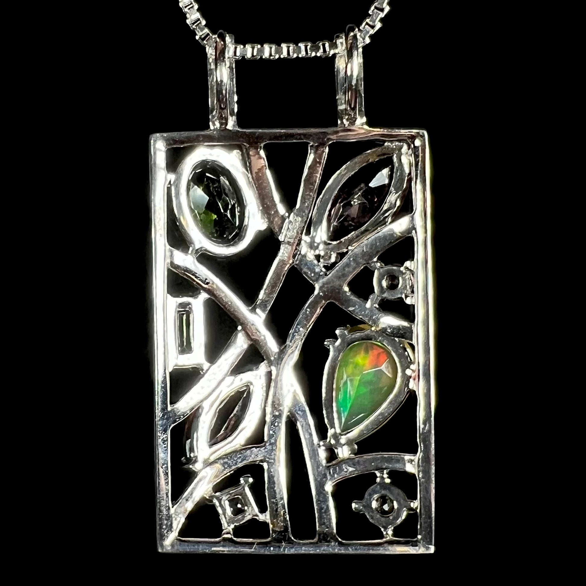 Back side of a sterling silver multi-gemstone Ethiopian opal and tourmaline necklace.