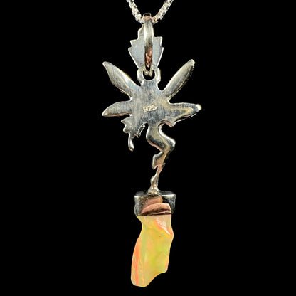 A sterling silver and Ethiopian opal fairy necklace, shown from the back side against a black background.