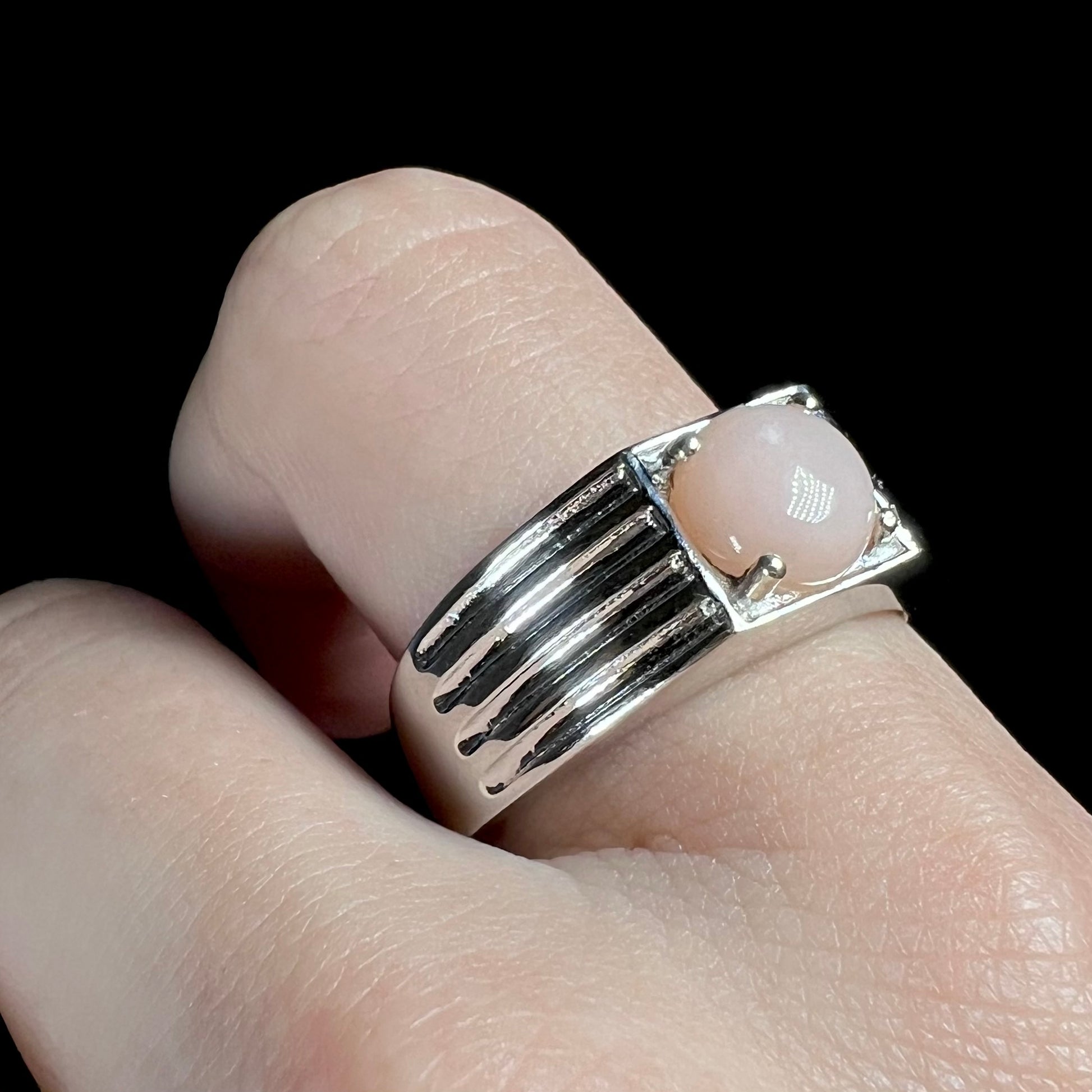 Sterling silver pink opal solitaire men's ring on finger