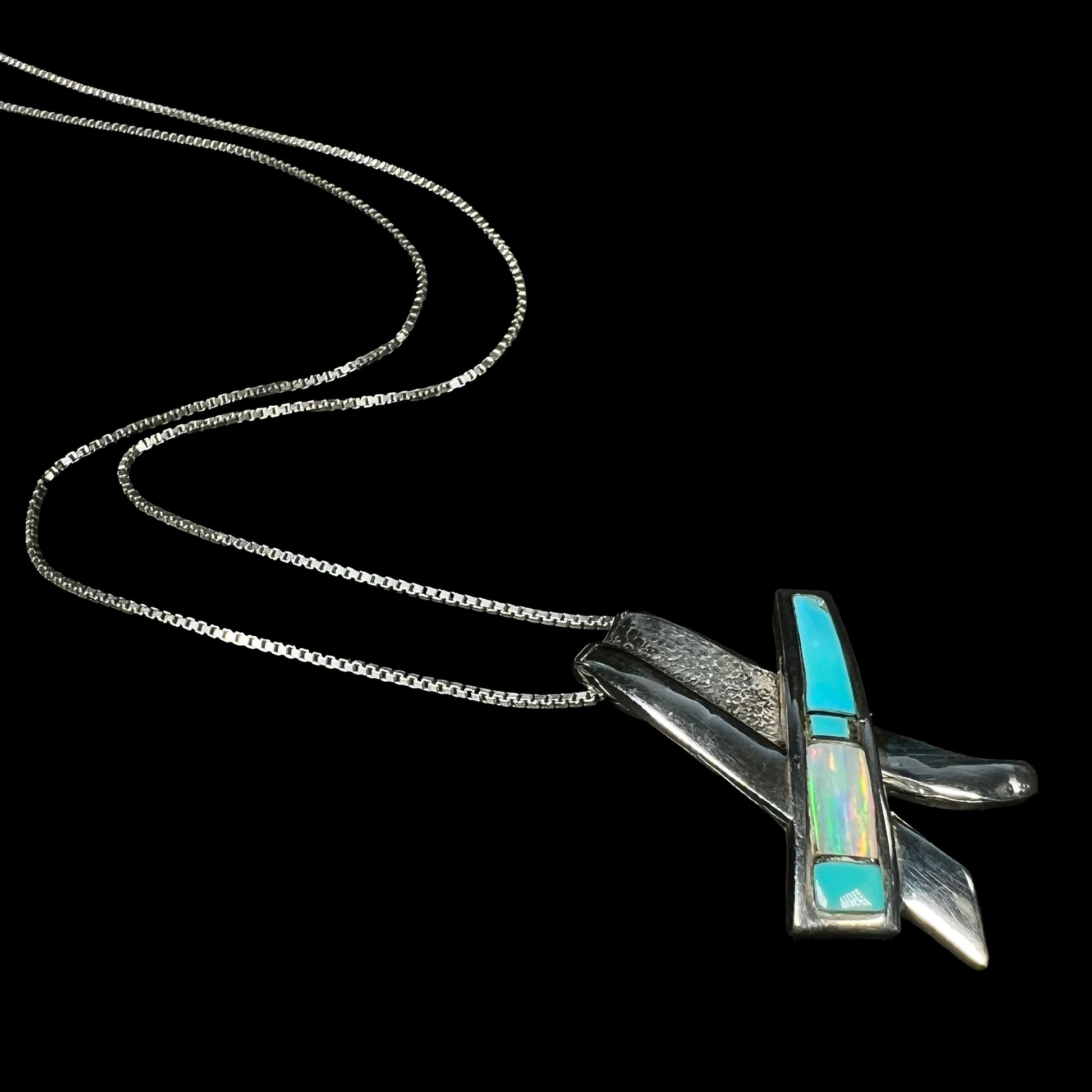A folded design sterling silver turquoise and lab-created opal inlay necklace.