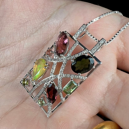 A sterling silver multi-gemstone necklace set with Ethiopian opal, tourmaline, and diamonds.