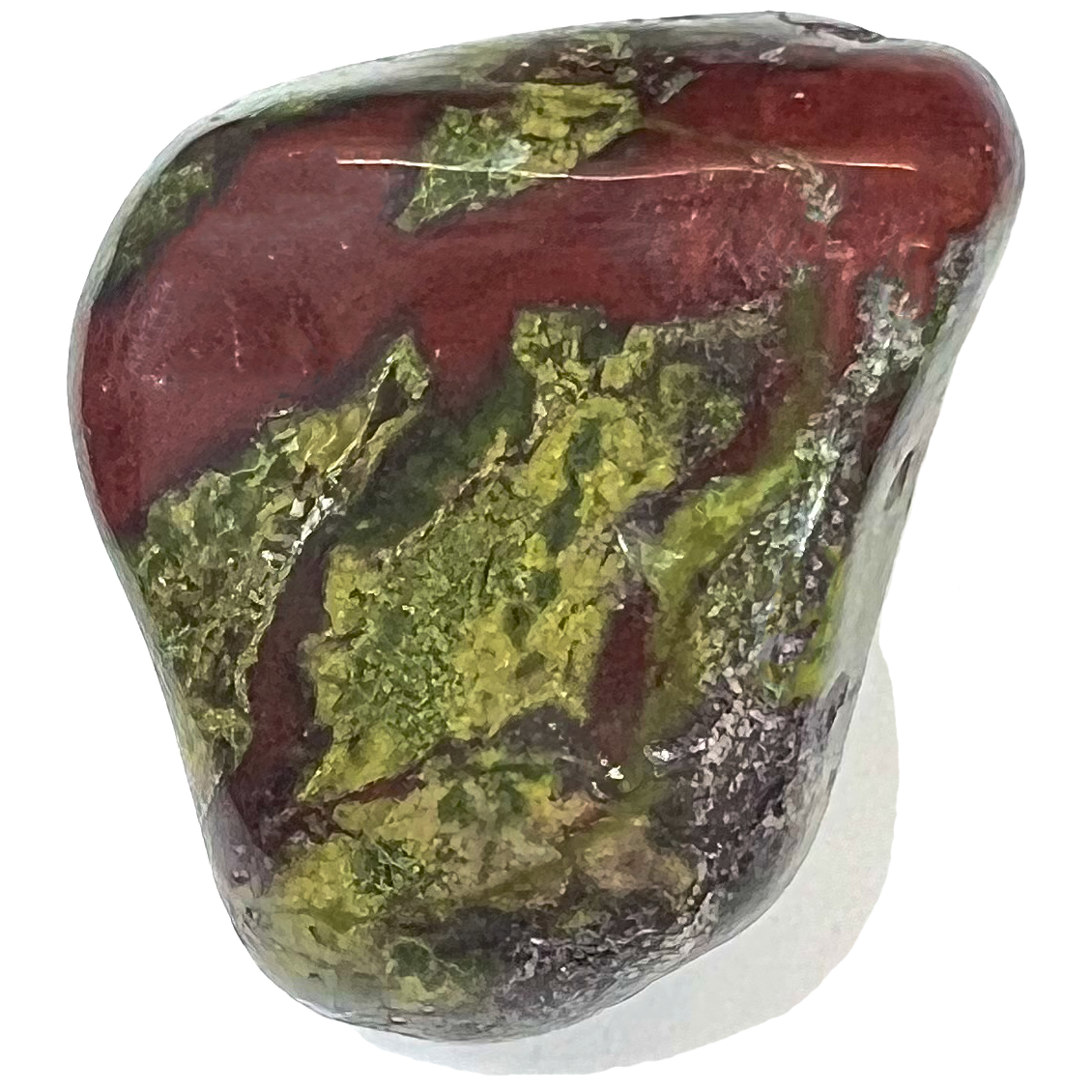 A tumble polished piece of dragon stone jasper.  The colors are deep brownish red with mossy green splotches.