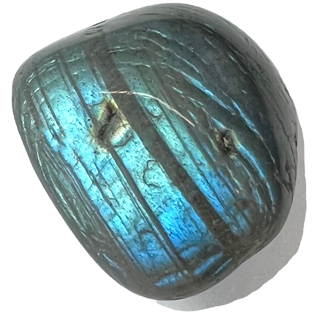 A tumble polished piece of labradorite feldspar.  The stone's body color is greenish blue and has bright blue labradorescent surface flashes.