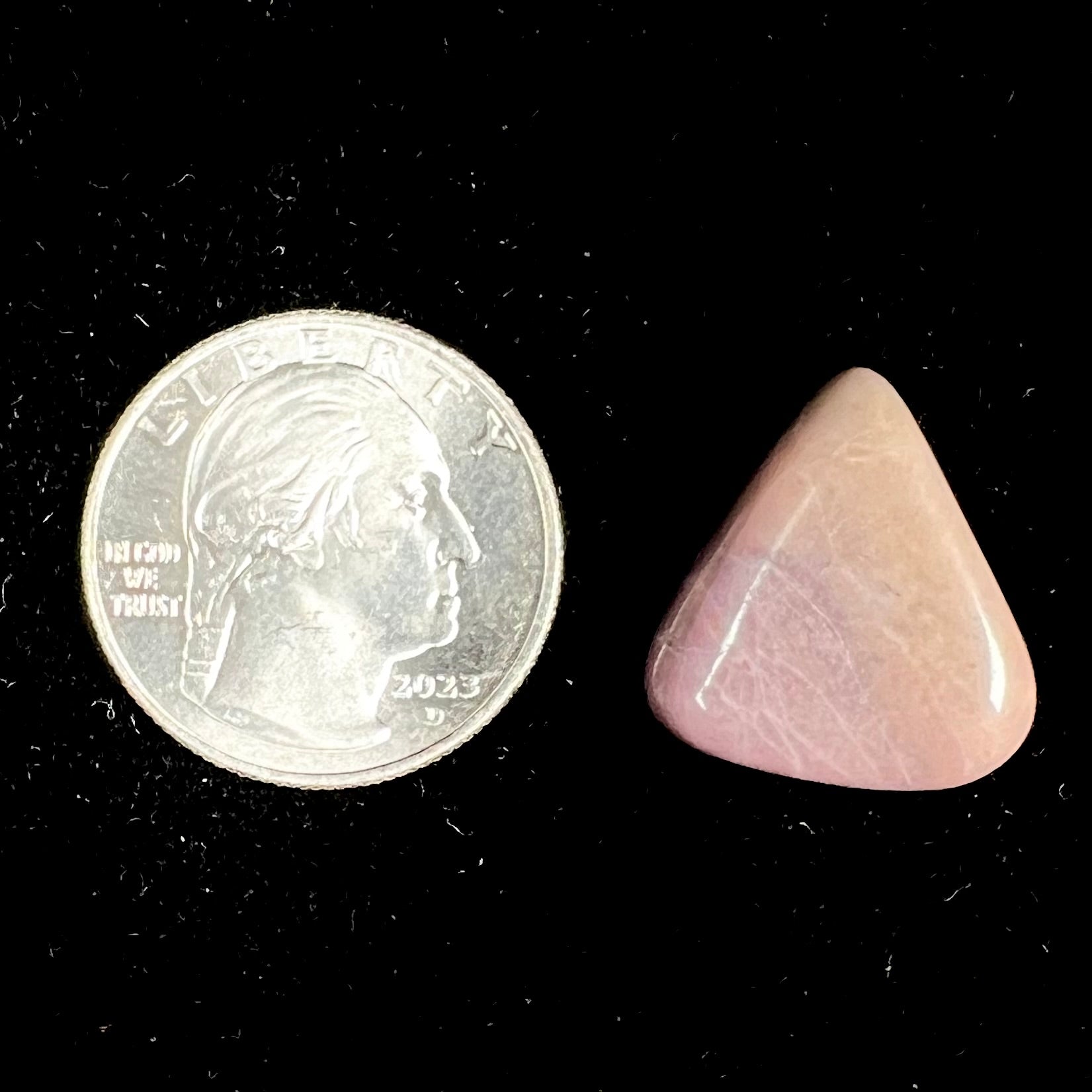 A tumble polished purple and brown turkiyenite jade stone from Bursa, Turkey.