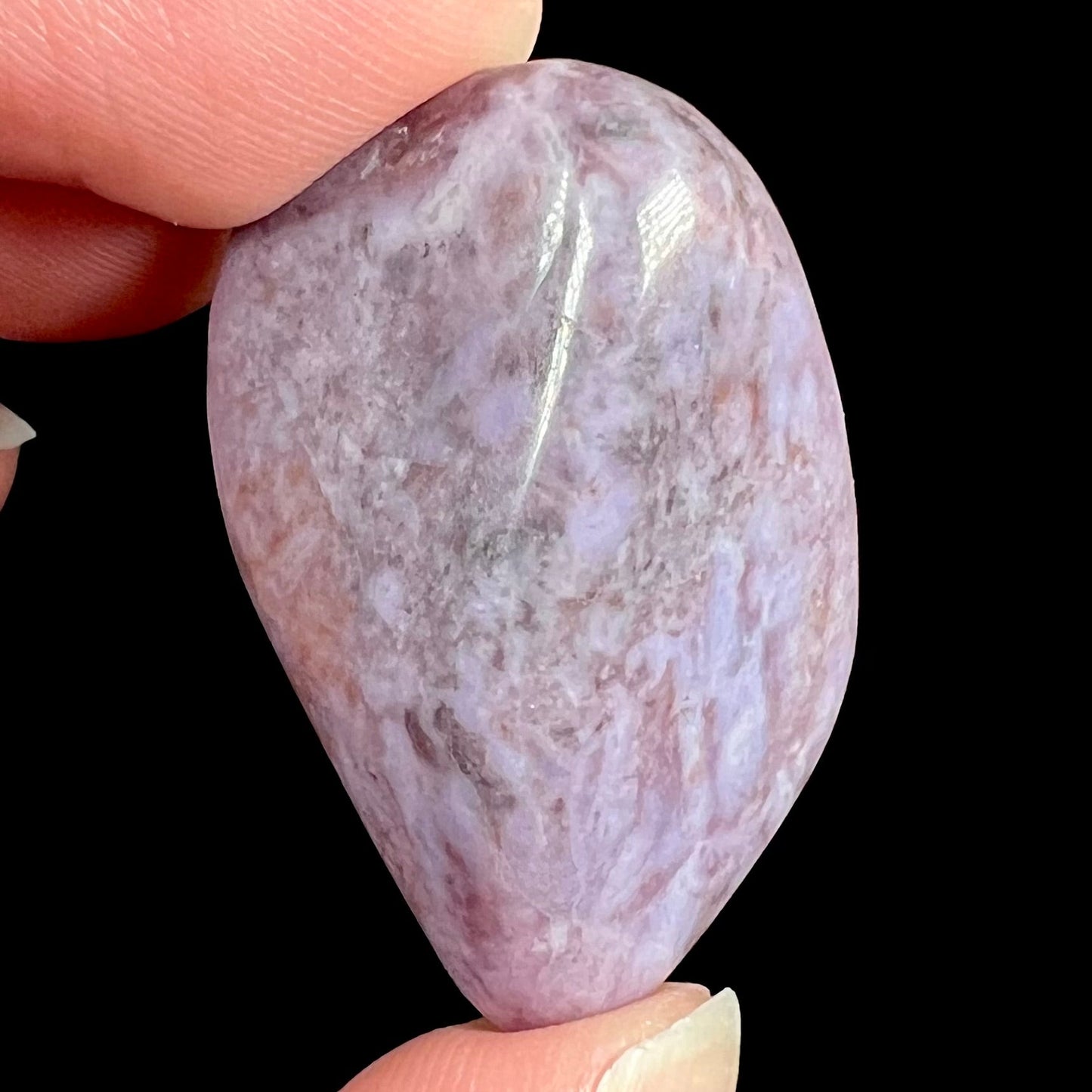 A tumbled purple turkiyenite jade stone from Bursa, Turkey.