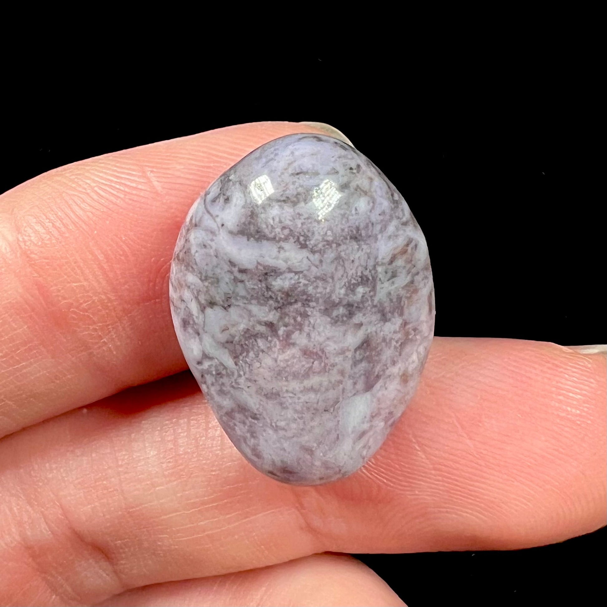 A tumbled purple turkiyenite jade stone from Bursa, Turkey.