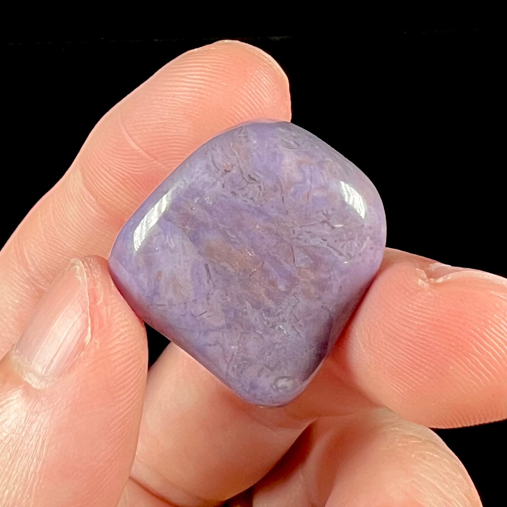 A tumble polished piece of purple turkiyenite jade stone.  Material from Bursa, Turkey.