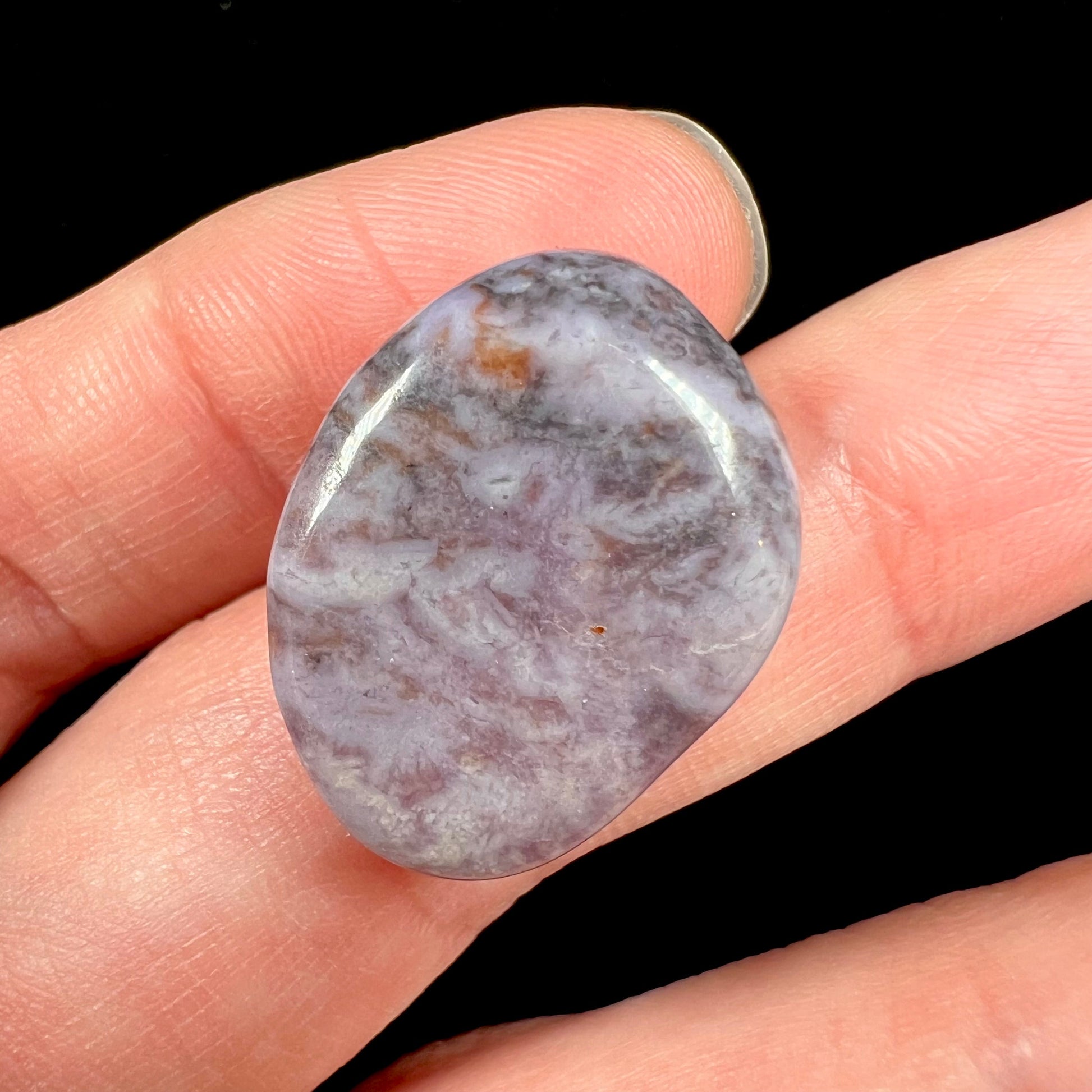 A tumbled purple turkiyenite jade stone from Bursa, Turkey.