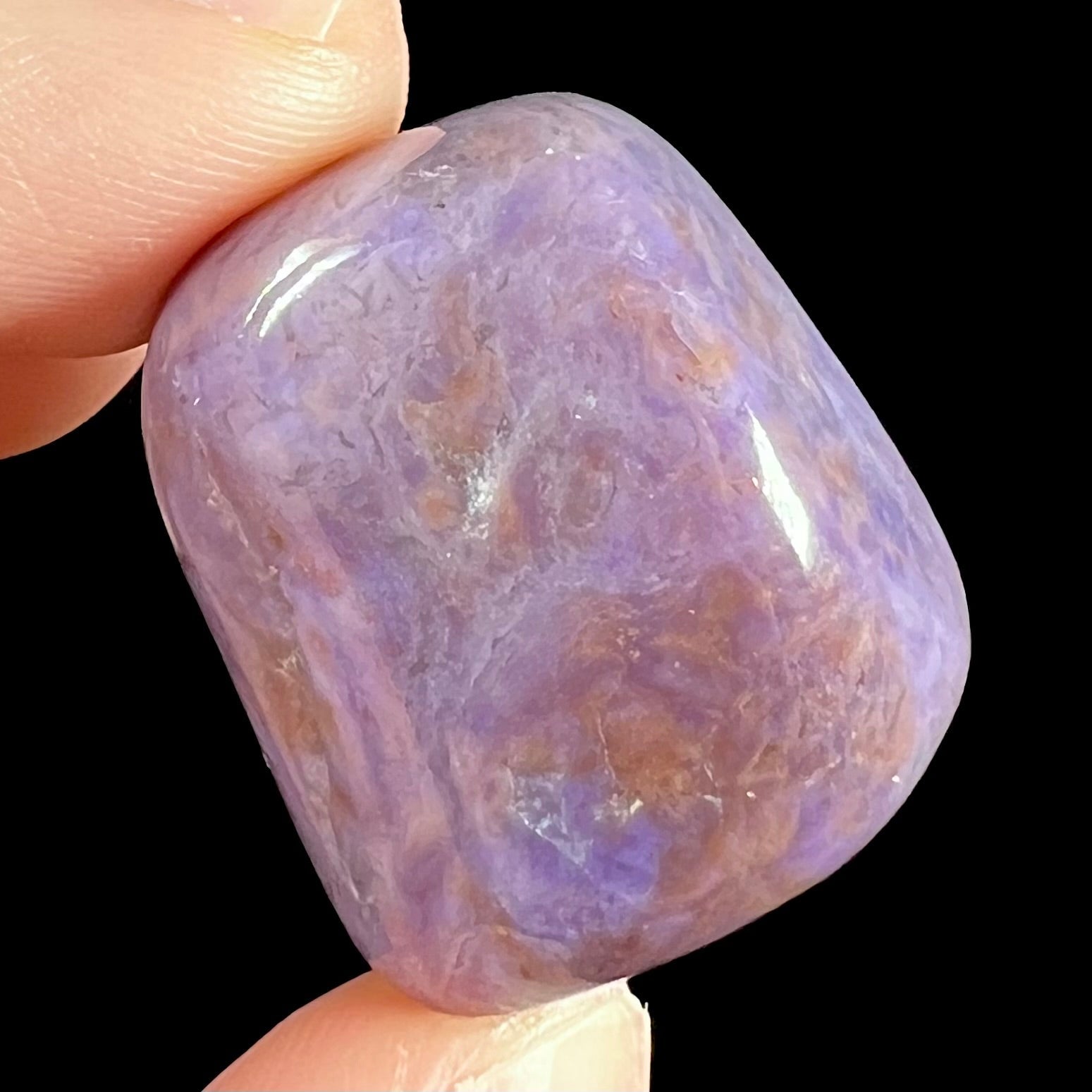 A tumble polished piece of purple turkiyenite jade stone.  Material from Bursa, Turkey.