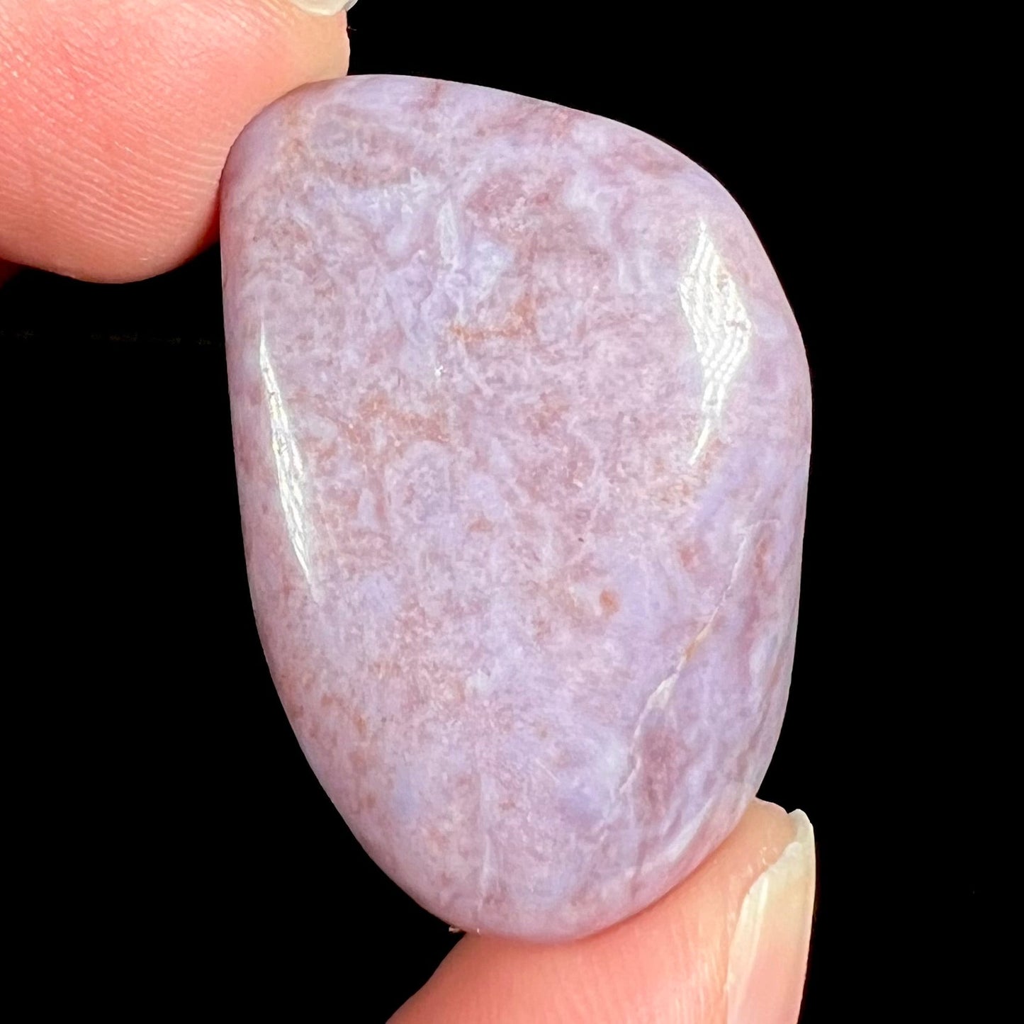 A tumbled purple turkiyenite jade stone from Bursa, Turkey.