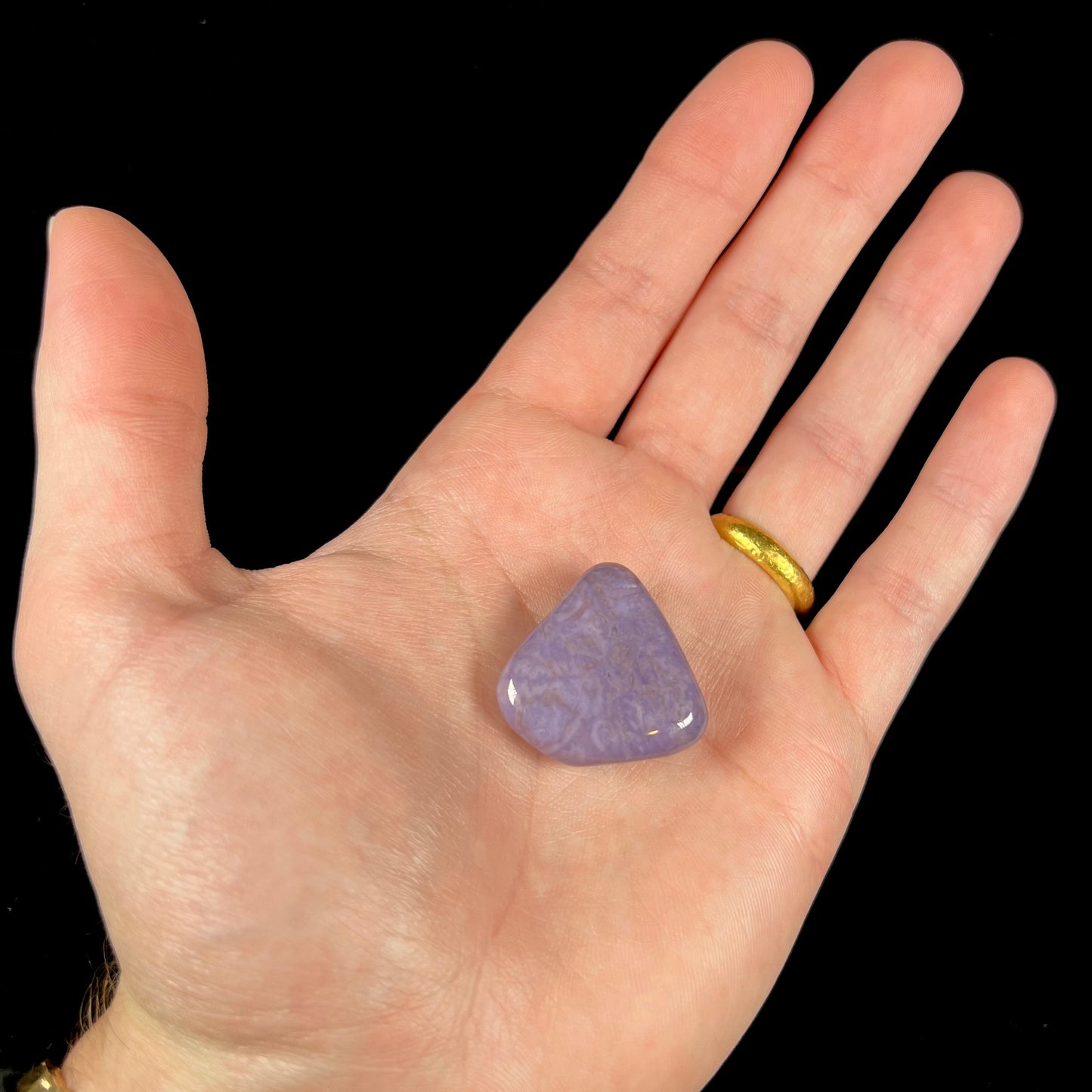 A tumble polished piece of purple turkiyenite jade stone.  Material from Bursa, Turkey.