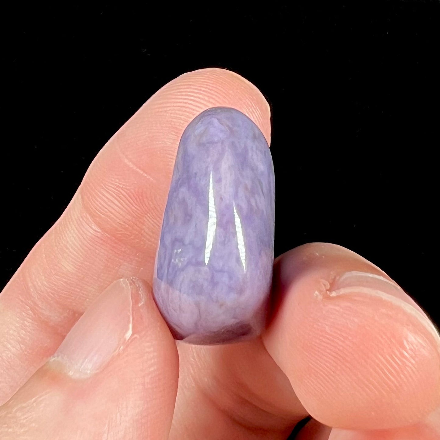 A rounded, tumbled piece of purple turkiyenite jade.  Bursa, Turkish material.