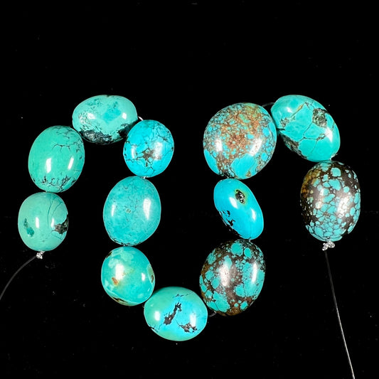 A strand of 12 large, dyed turquoise stones.