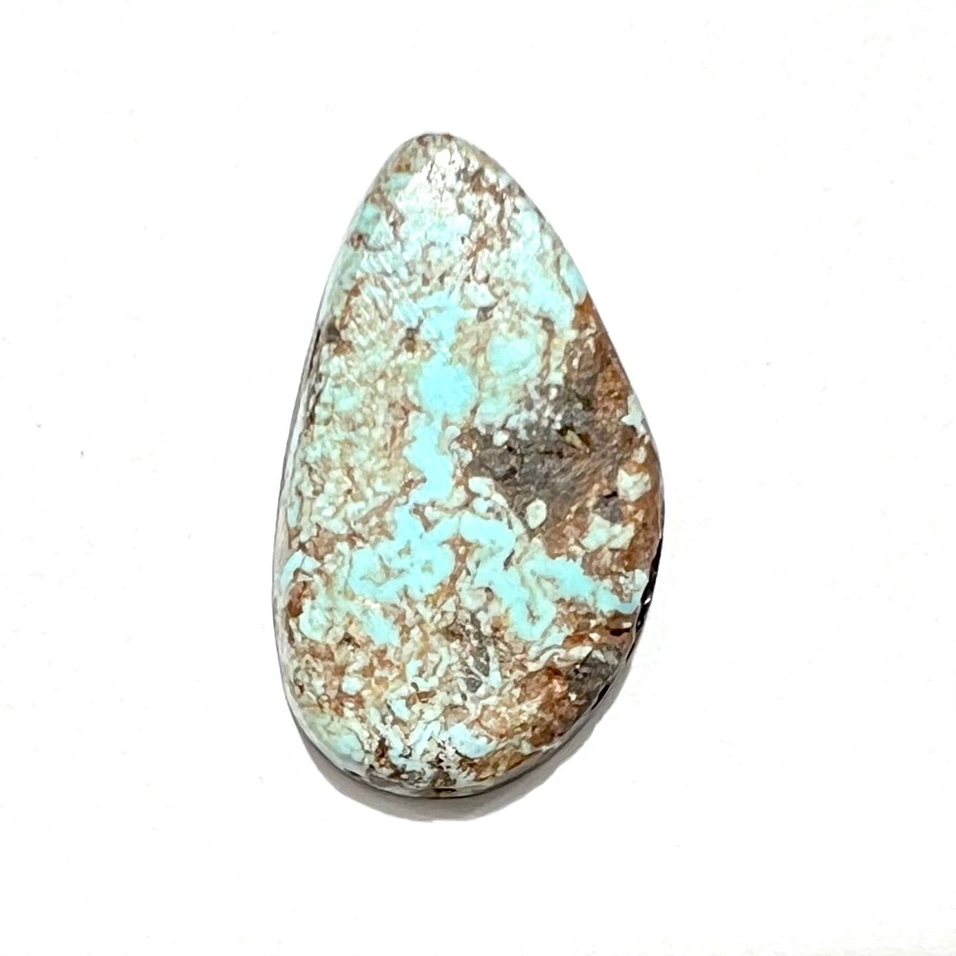 A loose, freeform cabochon cut Valley Blue turquoise stone from Lander County, Nevada.