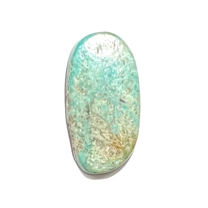 A freeform oval cabohcon cut turquoise stone from Lander County, Nevada.  The stone is greenish blue in color.