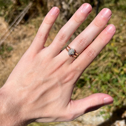 Vintage 14k gold reversible diamond cluster ring worn on hand under natural light