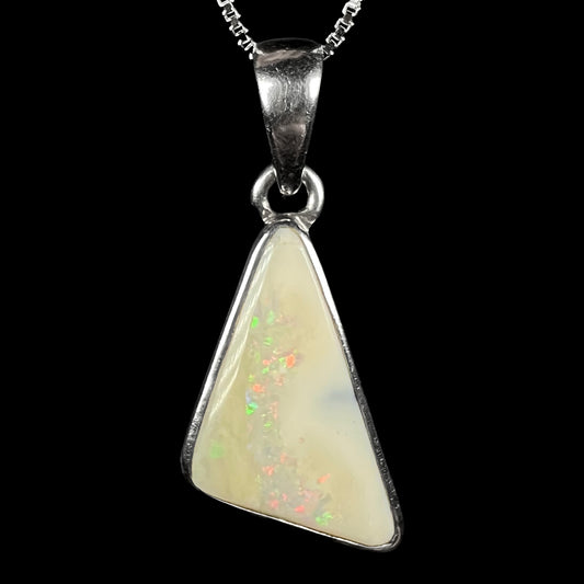 A white Australian boulder opal necklace in .950 silver, shown close-up against a black background.