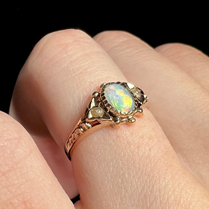 Antique White Cliffs, Australian opal women's ring shown from side angle on finger