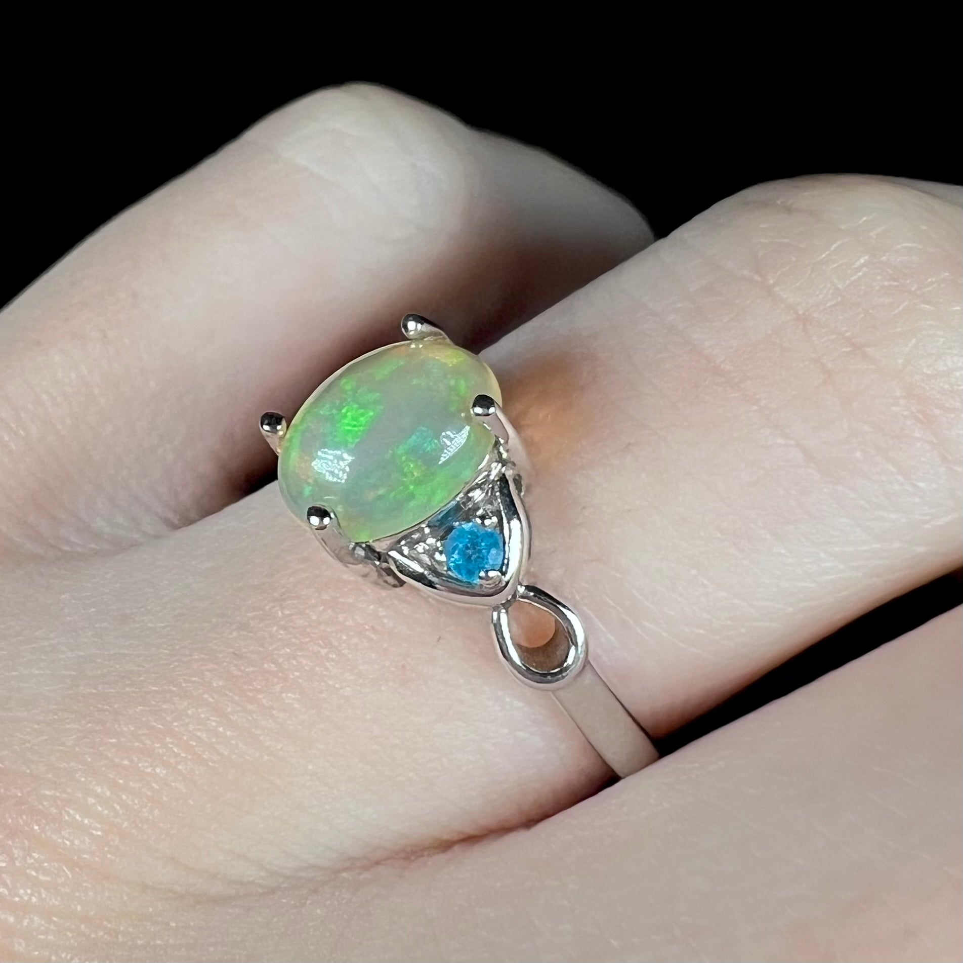 Women's Ethiopian opal and apatite ring in sterling silver on finger