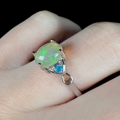Women's Ethiopian opal and apatite ring in sterling silver on finger